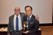 Dr. Nagib Callaos, General Chair, giving Prof. Shigehiro Hashimoto an award "In Appreciation for Delivering a Great Workshop and Plenary Keynote Address."